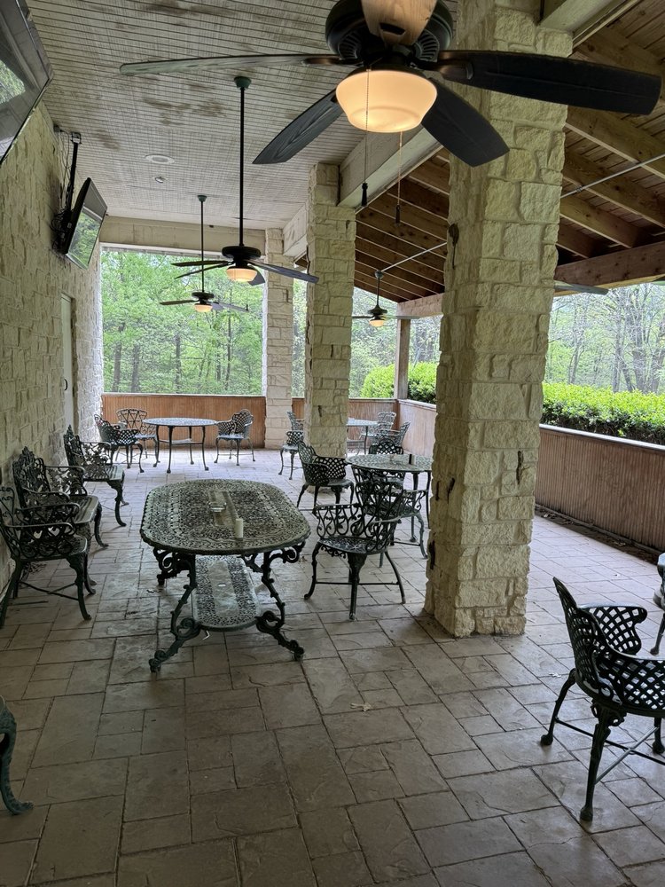 Shaded outdoor patio seating at Shumardii's